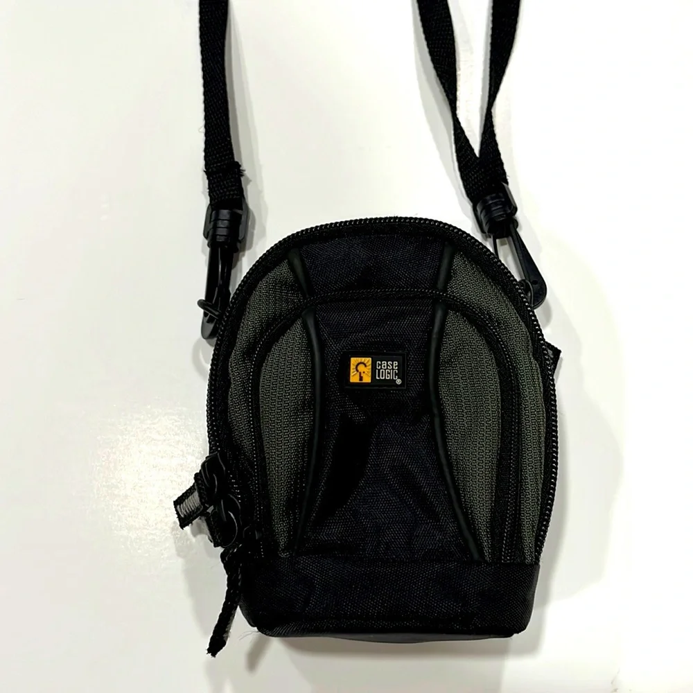 Case Logic Small black/dark green camera case with shoulder strap.